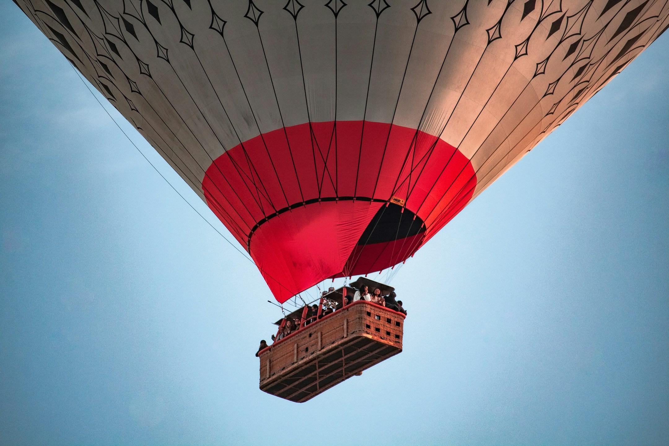 A hot air balloon, mid-flight, in Cappadocia, Turkey.