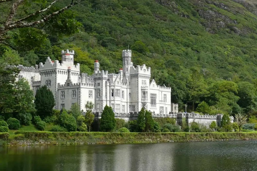 Kylemore Abbey with the lake and mountains behind it